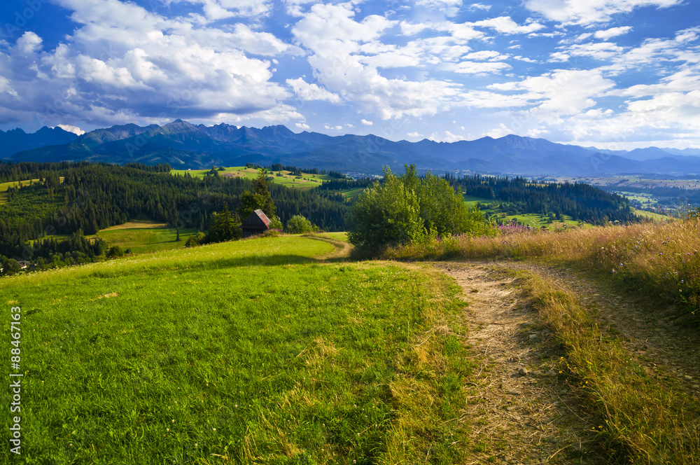 Path in a mountain landscape - hiking on sunny day Path in a mountain landscape - hiking on sunny day