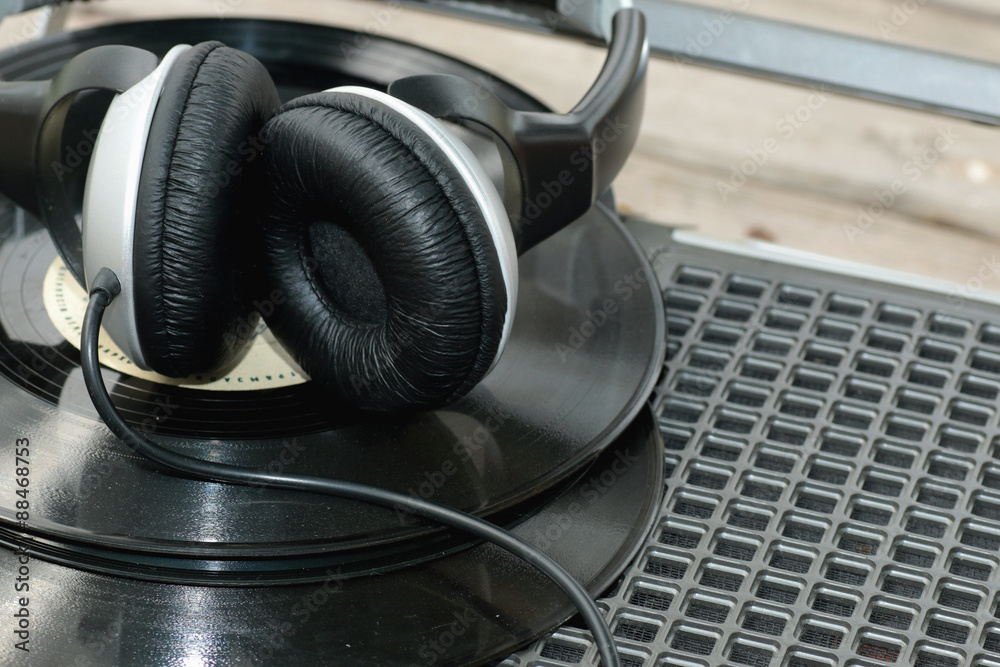 player with headphones on vinyl plates player with headphones on vinyl plates
