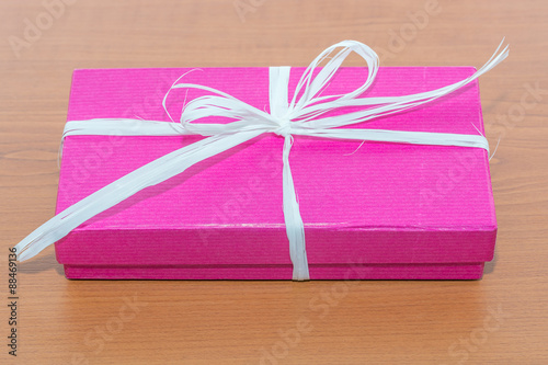 Lilac gift box on the table