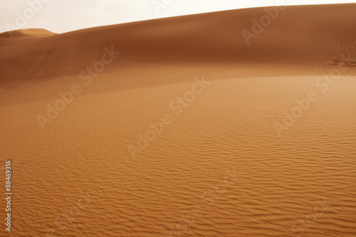 Closeup view of Sand Dunes in the Sahara. Desert in Sunset Scenery Background. Sand Waves.