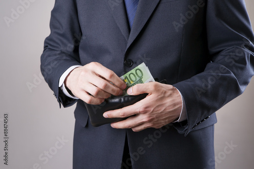 Businessman with money in studio. Corruption concept