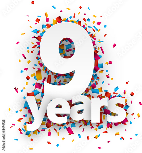 Nine years paper confetti sign.