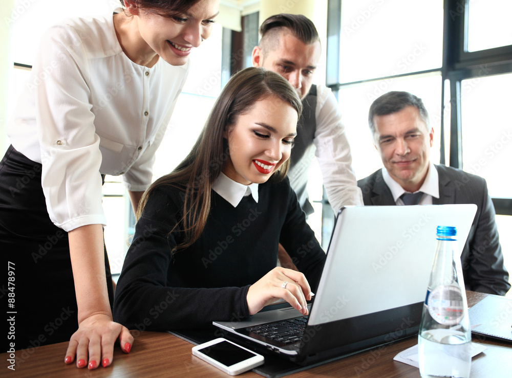 Image of business partners discussing documents and ideas Image of business partners discussing documents and ideas