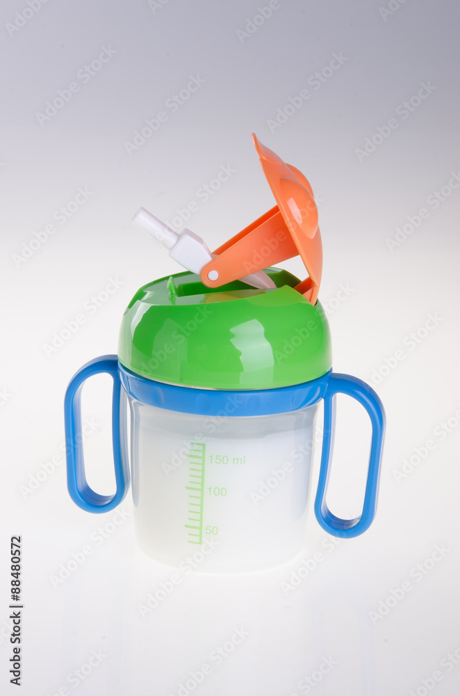 Obraz premium Baby bottle with milk on background