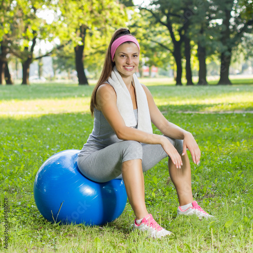 Fitness Healthy Smiling Young Woman Resting on Pilates Ball