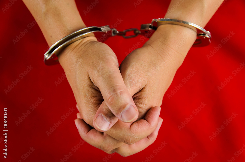 Hand of a man with handcuff