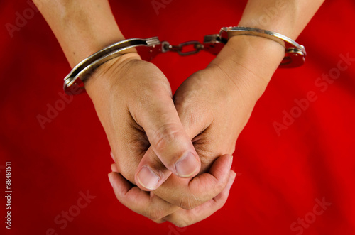 Hand of a man with handcuff