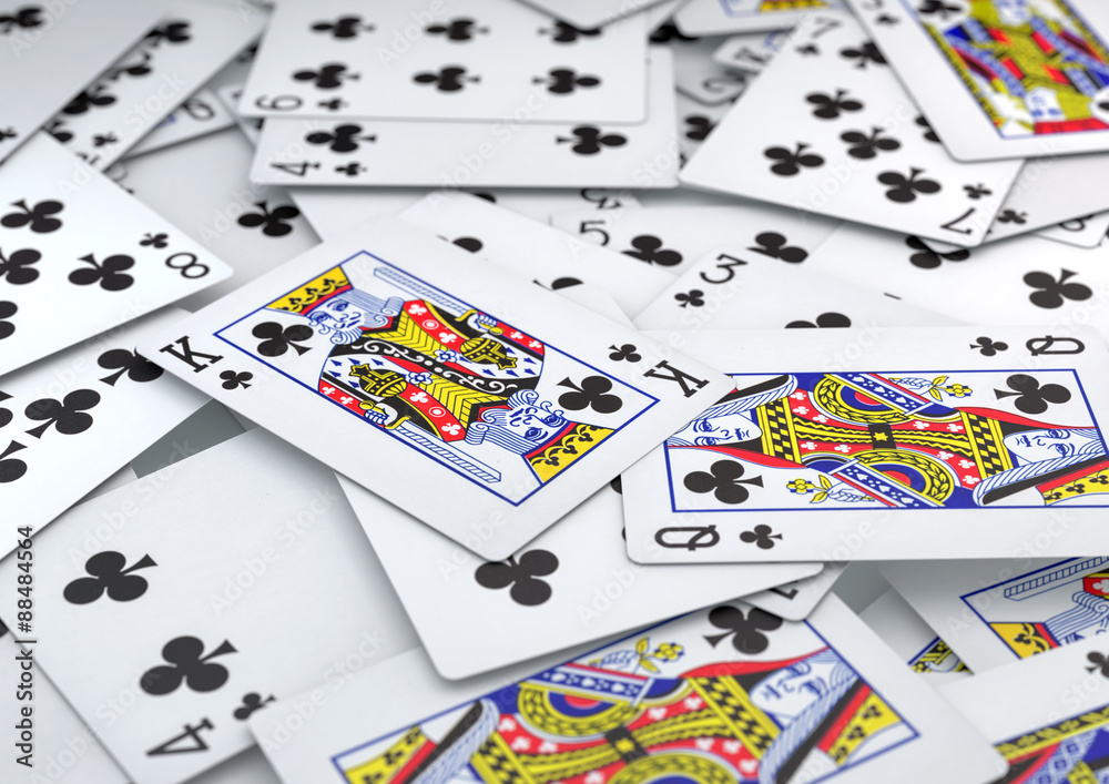 Pile of cards clubs suite lying on table Pile of cards clubs suite lying on table