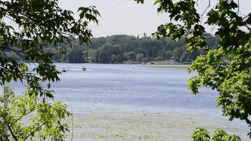 Speed motorboat riding on lake Zalew Zegrzynski in Poland photo