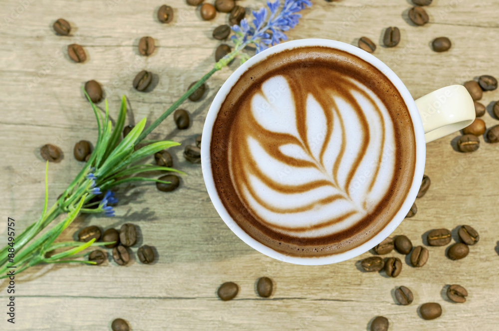 Cup of espresso hot drink with coffee beam and lavender flower o Cup of espresso hot drink with coffee beam and lavender flower o