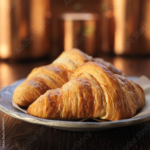 two croissants on plate and shot with selective focus