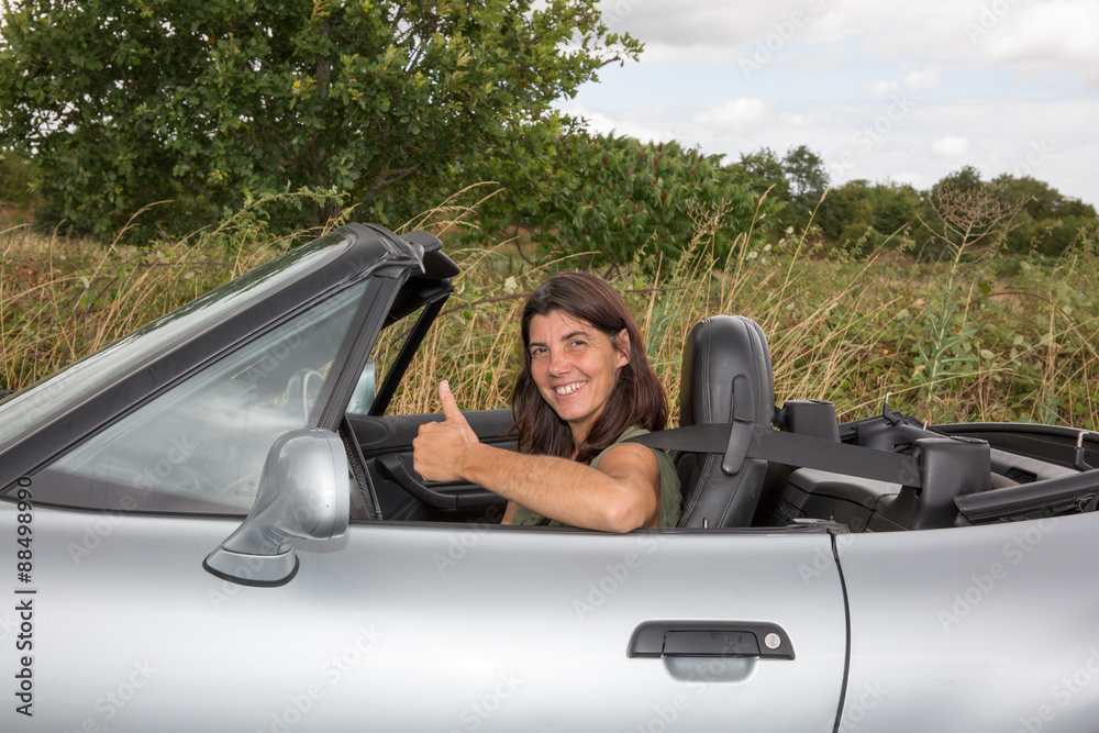 Brunette Woman Sat In A Convertible Sports Car Brunette Woman Sat In A Convertible Sports Car