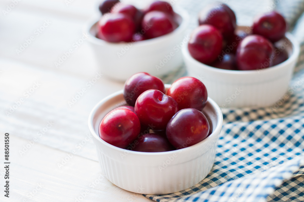 Sweet plums on wooden background