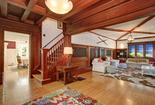 Authenic living room with brown and white decorative rug. © Iriana Shiyan