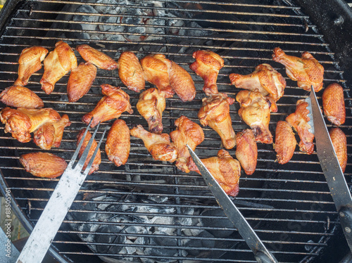 Chicken wings and drumsticks on a grill photo