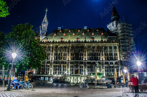 night ivew of the illuminated town hall in german city aachen. photo