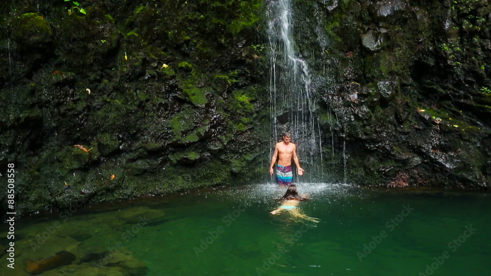Attractive Young Woman Swims Towards her Man and Kisses Him Under a Big Waterfall in Hawaii
Attractive Young Woman Swims Towards her Man and Kisses Him Under a Big Waterfall in Hawaii