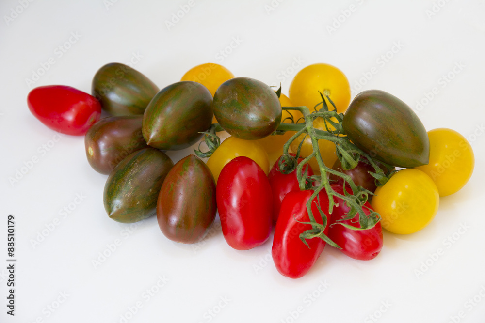 Close up assortment of red, yellow and green tomatoes Close up assortment of red, yellow and green tomatoes