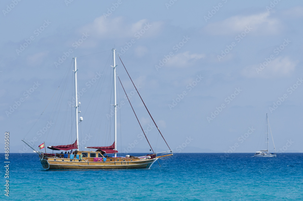 Sailing ship moored on a blue sea