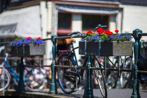 Bikes on the bridge with flowers in Amsterdam, Netherlands