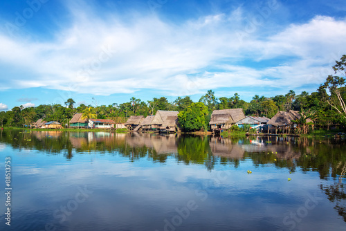 Town on the shore of the Yanayacu River in the Amazon rain forest near Iquitos, Peru photo