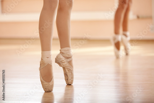Legs of young ballerinas, ballet dancing class
