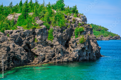 amazing stunning gorgeous landscape view with cliffs rocks above great Cyprus lake tranquil turquoise water at beautiful gorgeous Bruce Peninsula, Ontario