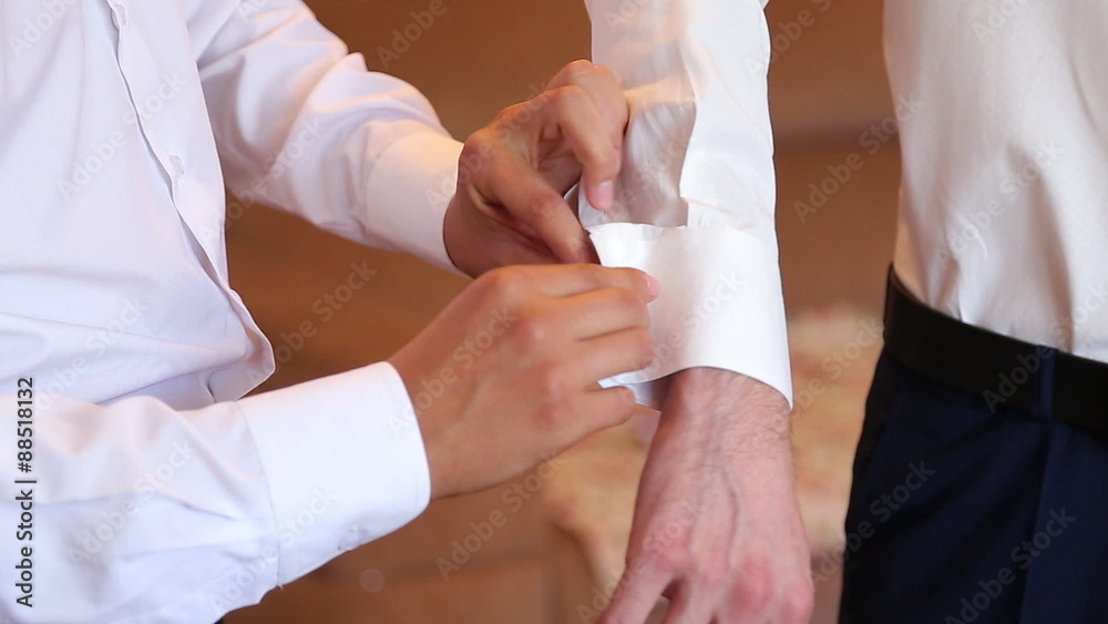 Finishing the Cuff. Cuff with cufflink being put on Finishing the Cuff. Cuff with cufflink being put on