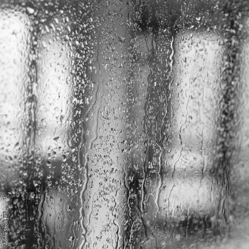 Fototapeta Raindrops on a window pane on the background