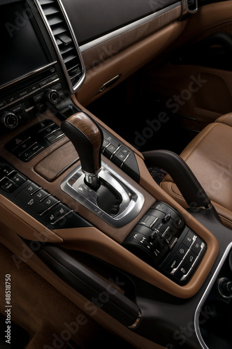 Luxury automatic car transmission control buttons and gear lever. Interior detail. © alexdemeshko