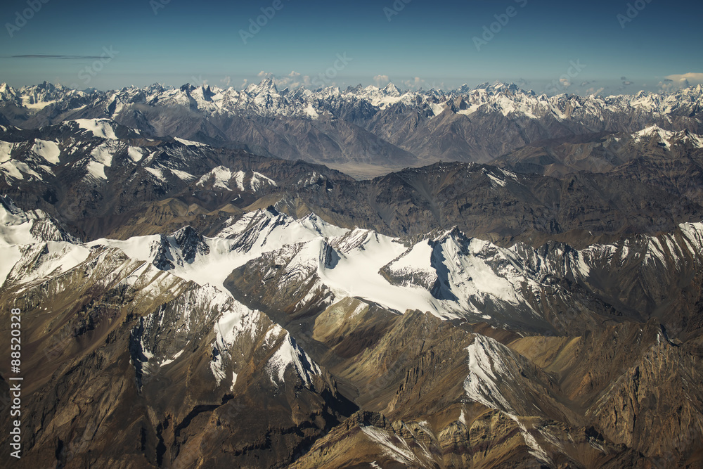 View of the Himalayas mountain range from the airplane window.