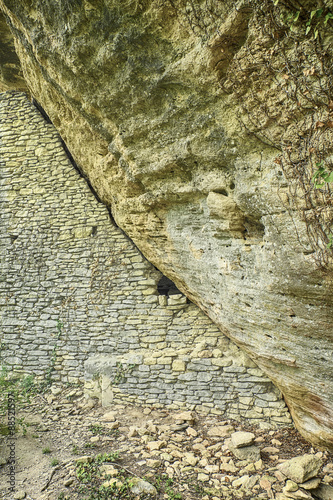 Stone House Under Cliff photo