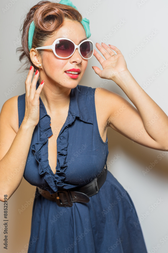 Female in nostalgic style smiles and has fun Female in nostalgic style smiles and has fun