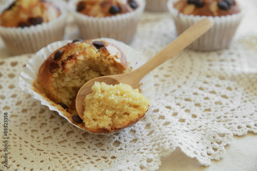 Homemade apricot chocolate chip almond slice muffins with spoon