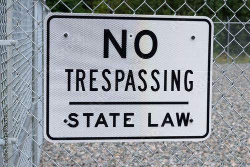 No Trespassing Sign on Security Fence