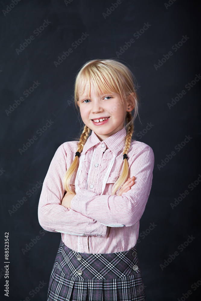 schoolchild on blackboard background