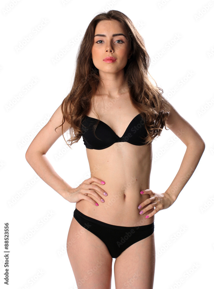 Beautiful brunette woman in black bikini isolated on white Beautiful brunette woman in black bikini isolated on white