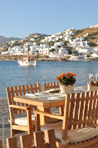 Dining table by Mykonos waterfront, Greece