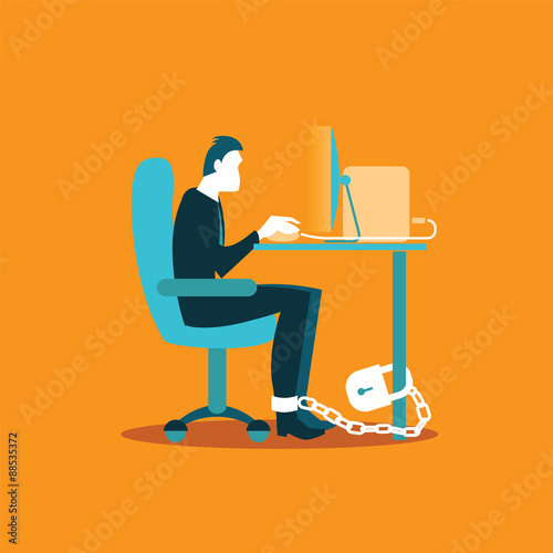 Office worker chained to a chair in the workplace