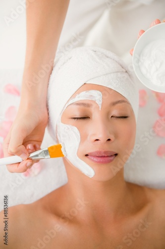 Attractive woman receiving treatment at spa center