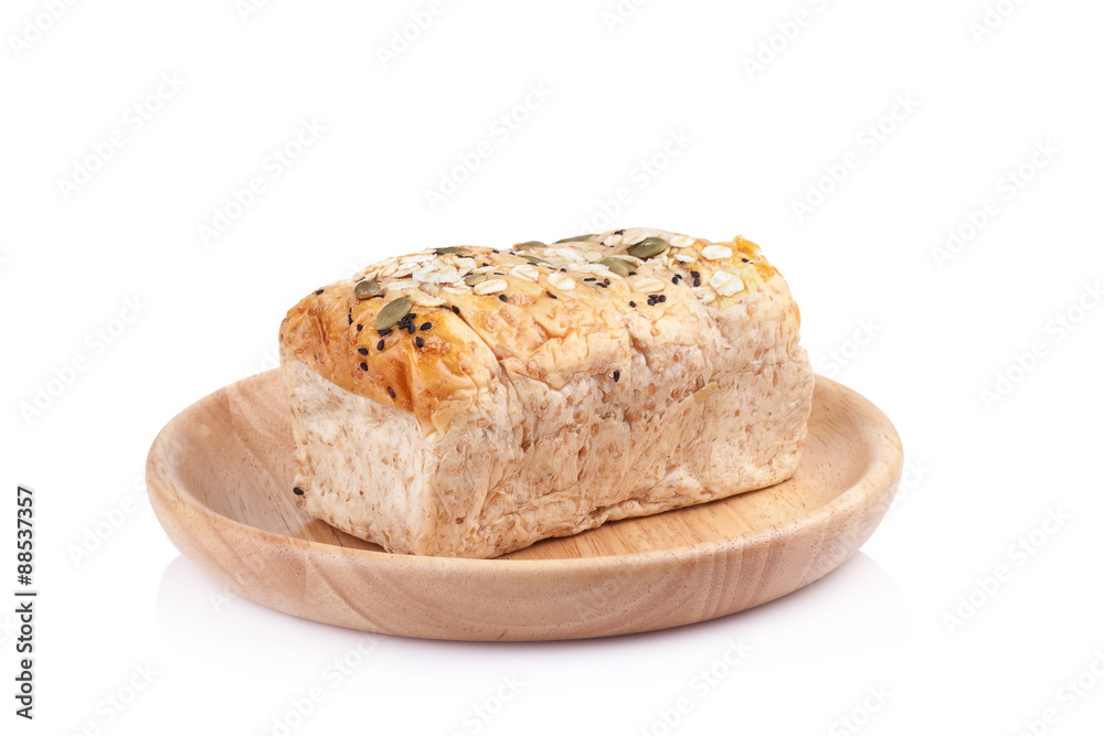 whole wheat bread in the wooden plates isolated on white backgro whole wheat bread in the wooden plates isolated on white backgro