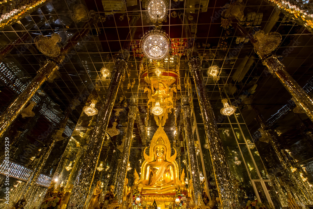 Golden buddha statue in temple. Places of worship.
