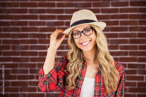 Gorgeous smiling blonde hipster posing