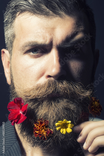 Man with flowerbed on head
