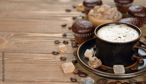 Cup of coffee and chocolate muffins