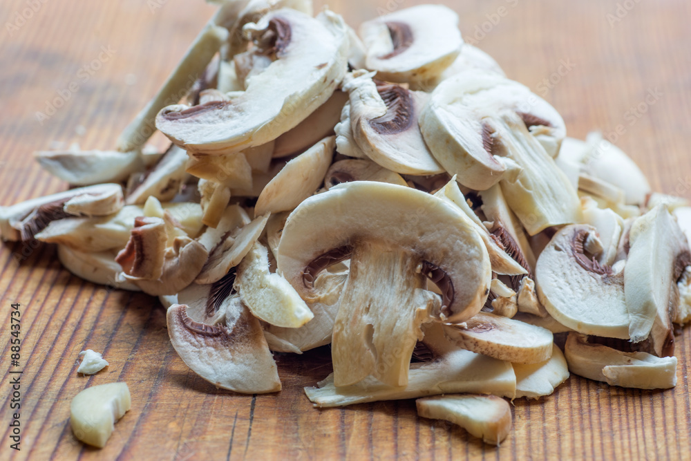 Fresh champignon mushrooms on a wooden deck Fresh champignon mushrooms on a wooden deck