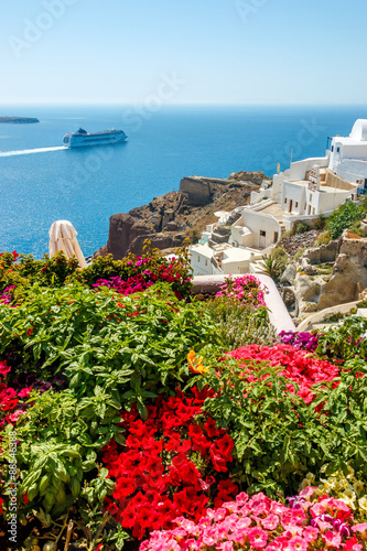 Flowers, buildings and cruise ship in Oia, Santorini