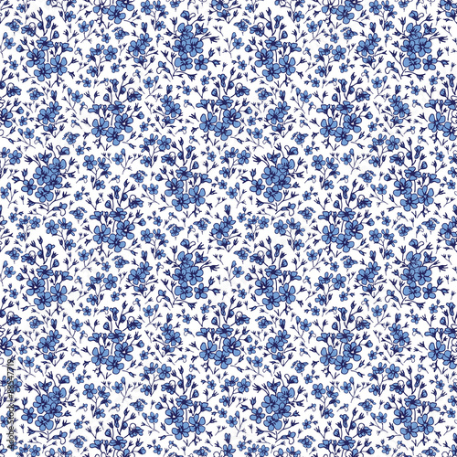 seamless pattern with hand-painted small blue flowers
