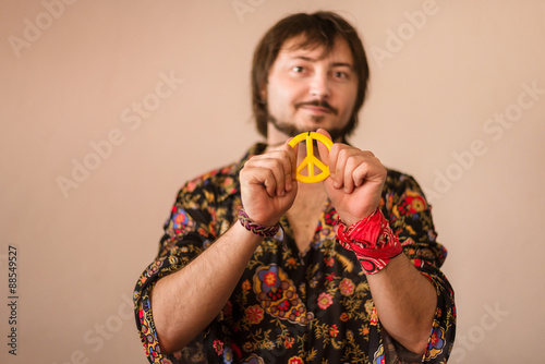 Male hippie taking a pacifik photo