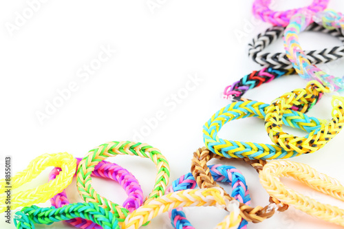 Colorful rubber band bracelets on white background
